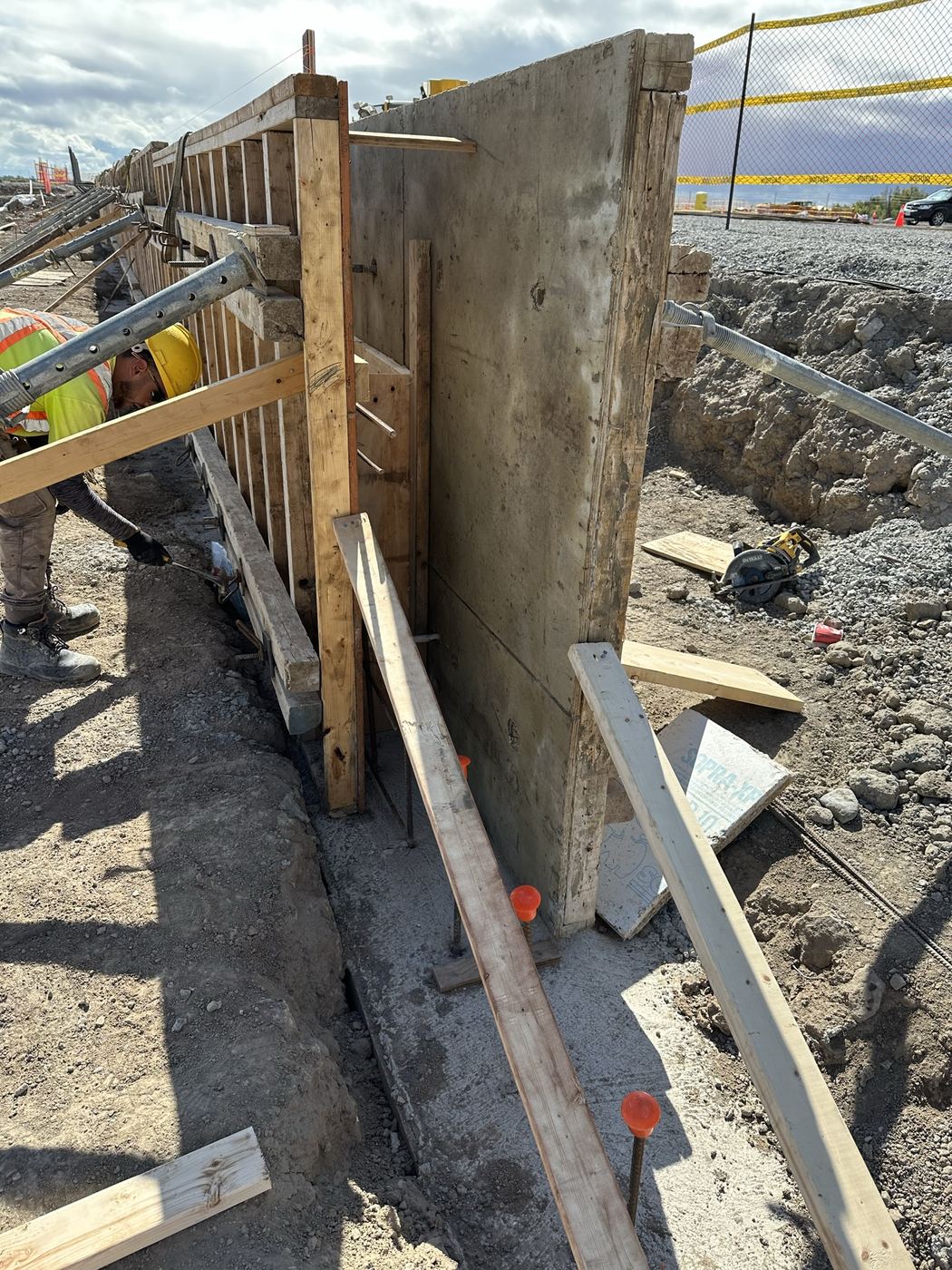 Worker setting conventional wall formwork