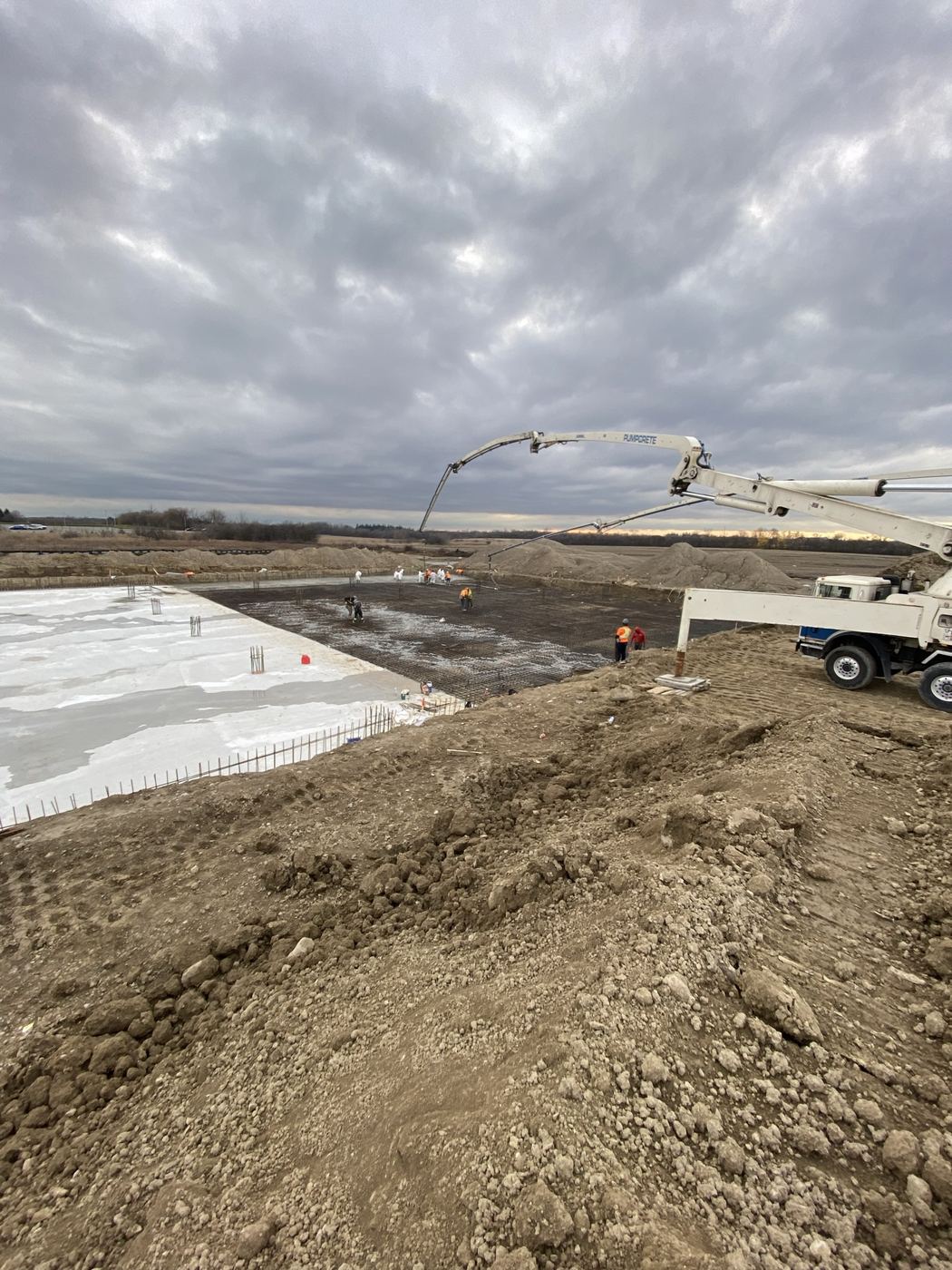 Concrete pump truck placing a large slab
